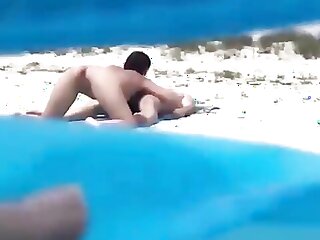 Amateur nudist couple caught having sex on camera at nudist beach