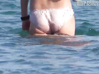 A girl decides to swim at the beach in her panties - Watch here for free